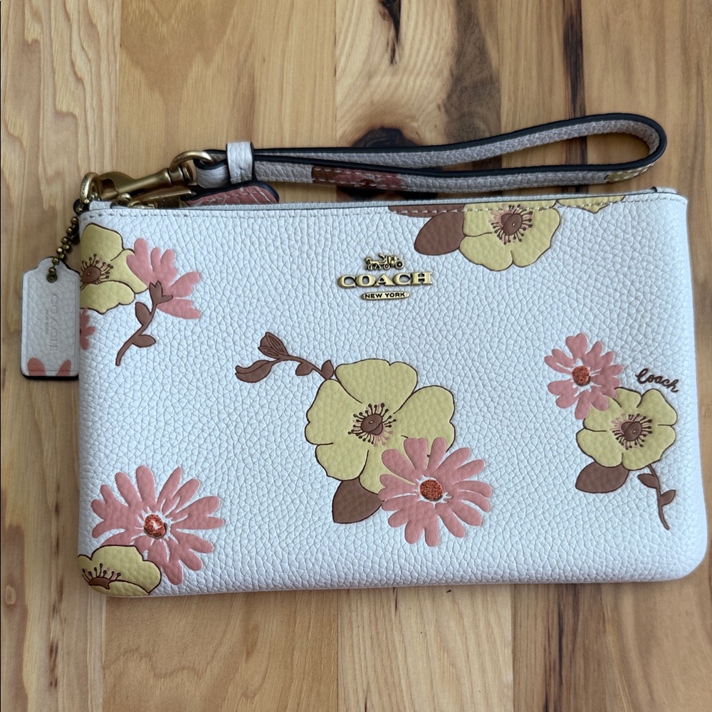 EUC Coach small wristlet with floral print